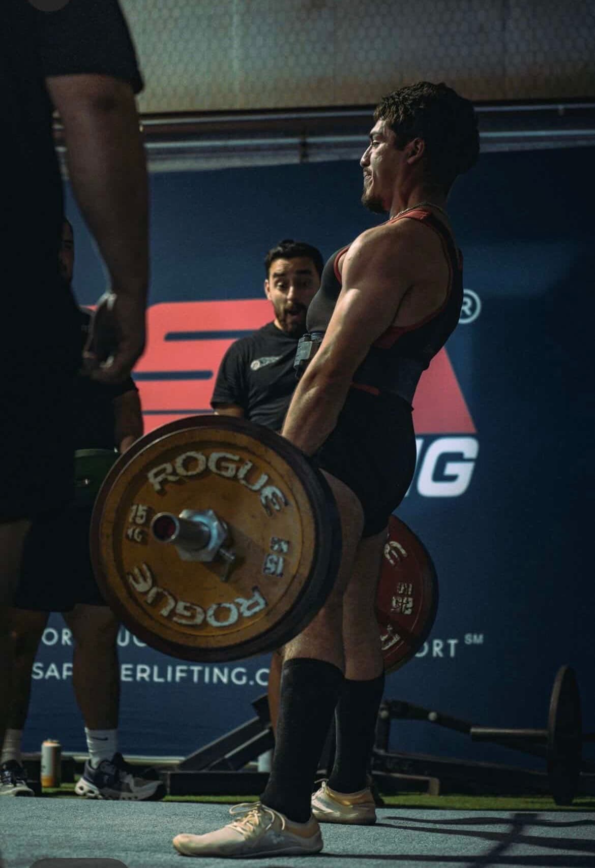 Sebastian Martinez, ChimpFit founder, deadlifting at a powerlifting meet